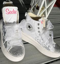 These are the Platform Move from CONVERSE. I use rhinestones on the toe and along the side, with a few down the back. I will add a silver bow unless you ask for a different color. Great Wedding shoes too, put Mrs on one shoe, last name on the other. If you like this design but want pearls instead just ask or write it in your order. Having a party? What a great idea. Sweet 16, Bat Mitzvah or any special occasion! Let's add some BLING to your day. How pretty are these? I can do the monochrome all Wedding Custom Sneakers With Rhinestones And Round Toe, Custom Wedding Sneakers With Rhinestones, Wedding Low-top Sneakers With Rhinestones, Wedding Lace-up Sneakers With Rhinestones, Lace-up Sneakers With Rhinestones For Anniversary, White Custom Lace-up Sneakers With Rhinestones, White Lace-up Custom Sneakers With Rhinestones, White High-top Custom Sneakers With Rhinestones, Bride Sneakers