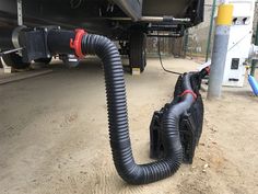 the hose is attached to the back of a truck