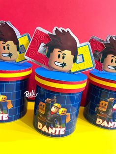 three lego movie character ice cream cups with stickers on them