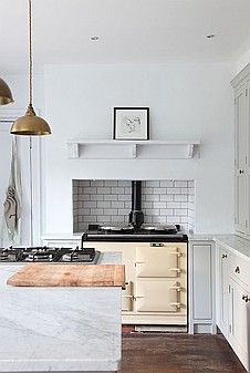 a kitchen with an oven, stove and counter top in it's center island