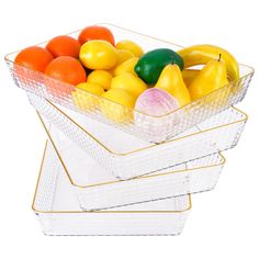 three glass bowls filled with different types of fruit on top of each other in front of a white background