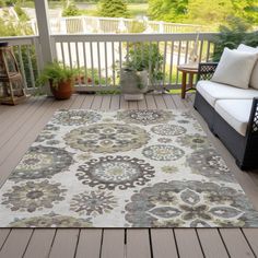 an outdoor area rug on a deck with furniture