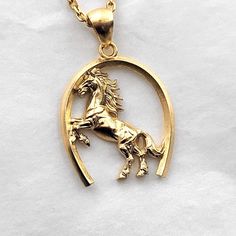 men's horse necklace pendant 1 made in 14k solid gold or 18k solid gold this necklace pendant is a horse with exquisite details in a horse's hoof. - pendant height is 28mm without the bail. - model wears a 2.1mm chain 50cm. - materials: 14k solid gold, 18k solid gold - designed by carre d'or - made in south korea 14k gold horse pendant necklace weight pendant only 7.66g (±5%) with a 2.1mm chain 42cm 13.62g (±5%) with a 2.4mm chain 42cm 15.49g (±5%) with a 3.0mm chain 42cm 19.24g (±5%) 18k gold h Classic Gold Jewelry With Horse Design, Gold Horse Design Pendant Necklace, Gold Pendant Necklace With Horse Design, Formal Horse Design Pendant Jewelry, Classic Horse Design Pendant Necklace, Classic Necklace With Horse Design For Gift, 14k Yellow Gold Jewelry With Horse Design, Mens Necklace Gold, Men's Necklace Gold