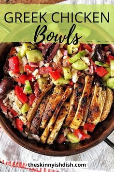 a bowl filled with meat and vegetables on top of a table