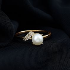 Product Details Make a statement with the stunning Freshwater Pearl Ring, a classic design featuring a round-cut Freshwater Pearl delicately set in a prong setting and accented with sparkling Diamond. A perfect symbol of commitment and love, this Freshwater Pearl Ring is a great choice to celebrate your special bond with your partner while highlighting your unique sense of style. Product Information SKU SHP-RINGS072210057 Weight 2.00 gm (Approximate) FRESHWATER PEARL INFORMATION No.of Stones 1 P Diamond With Pearl Ring, Diamond And Pearl Ring, White Pearl Ring, Pearl Engagement Ring, Freshwater Pearl Ring, Pearl And Diamond Ring, Ring With Diamond, Sparkling Diamond, Diamond Ring Settings