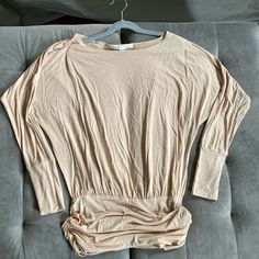 Size Xs, Rusched Waist, Creamy Tan Color, Dolman Sleeve, Lovely Shirt, Soft Comfortable Fabric, Nwot Good Condition, Non Smoking White Knit Top, Dolman Sleeve Top, Cold Shoulder Shirt, Off Shoulder Shirt, Dolman Sleeve Tops, Red Tee, Boston Proper, Asymmetrical Tops, Shoulder Shirts