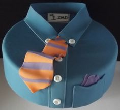 a blue cake with an orange and purple tie on it's lapel collar