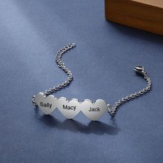 Specially made to fit three loving names on your wrist! This Chain Of Love - 3 Custom Name Sterling Silver Chain Bracelet is the perfect gift for moms, sisters, friends, or significant other! The custom-made bracelet is made from sterling silver and features three hearts joined together, each with a special named engraved. The personalized bracelet is designed with a lobster clasp to make it adjustable to your wrist size. Gifting our custom-made jewelry will show that you care! Looking for an en Personalized Sterling Silver Heart Friendship Bracelet, Personalized Heart Name Bracelet For Best Friend, Personalized Stainless Steel Heart Bracelet For Mother's Day, Personalized Heart Bracelets For Mom, Personalized Heart Bracelets As Gift For Mom, Personalized Bracelets As Gift For Mom, Personalized Heart Bracelet For Best Friend Gift, Personalized Heart-shaped Bracelet For Mom, Personalized Heart Bracelet For Mom On Valentine's Day