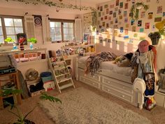 a bed room with a neatly made bed and lots of clutter on the walls