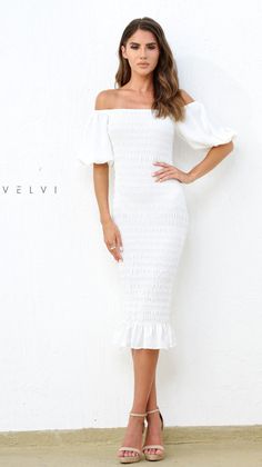 The Skyla Shirred Midi Dress in White by Velvi isÂ a simple and elegant style that you'll feel your best in! Adding a hint of drama with the puff lantern sleeve detail and a shirred body style makes it the perfect wear-all-day style. White Midi dress Shirred body Pull-on style; no zipper required Trendy lantern sleeve Elasticised cuff on sleeve to keep their shape Elegant puff sleeves - can be worn on the shoulder or off the shoulder Can be worn on or off shoulder Ruffle detailing Slim fitting G