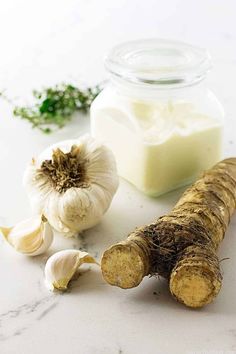 garlic and butter are on the counter next to each other