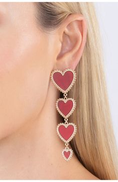 Gleaming goldtone beads frame a gradient chain of hearts on these statement drop earrings. Post back Goldtone plate, cubic zirconia Imported Heart Pattern Earrings, Jessica Rabbit Earrings, Gala Is Love Jewelry, Heart Face Earrings, Paul Valentine Earrings, Chain Of Hearts, Buying Gold, Link Earrings, Heart Dangle Earrings