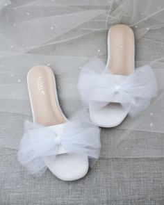 "Classic slide flat sandals for casual and dressy look with added oversized tulle bow. Simple and easy wear for brides, bridesmaids and/ or wedding parties. DETAILS: COLORS AVAILABLE: White, Off White and Ivory UPPER: Synthetic upper and lining MATERIALS: Mandmade outsole - Please see our \"Policies\" section for information regarding RETURNS and EXCHANGES. - Stay updated with latest news or promotion as we grow and follow us on the following outlets: Instagram: http://instagram.com/shop.kaileep Cheap White Sandals For Playtime, Cheap White Wedding Sandals, Cheap White Summer Flats, Cheap Elegant White Sandals, Cheap White Party Sandals, Bridesmaids Sandals, Bridesmaid Sandals, Bride Sandals, Sandals Wedding