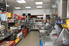 a restaurant kitchen filled with lots of food