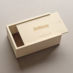 an empty wooden box with the lid open