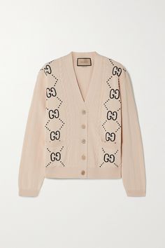 Gucci's classic cardigan is intarsia-knitted from soft cotton and patterned along the front with the brand's iconic 'GG' monograms. It has a slim fit that's relaxed through the slightly dropped shoulders, making it easier to layer. Wear yours with a camisole and jeans. Luxury Cardigan, Luxury Chic Gucci Cardigan, Gucci Outfits Women, Gucci Luxury Wool Cardigan, Luxury Gucci Wool Cardigan, Designer Gucci Jacquard Knit Cardigan, Gucci Cardigan, Gucci Designer Long-sleeve Cardigan, Gucci Outfits