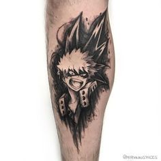 a man's leg with a black and white tattoo design on the calf area