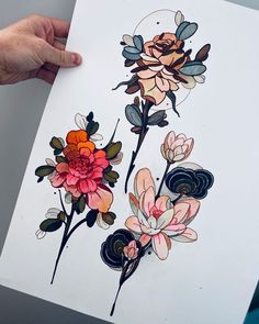 a person holding up a piece of paper with flowers on it, and another drawing in the background