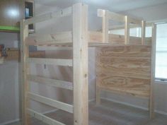 bunk beds are being built in the corner of a room with no one around them