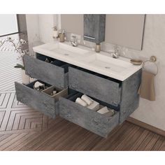 a bathroom with two sinks and mirrors on the wall next to a wood flooring area