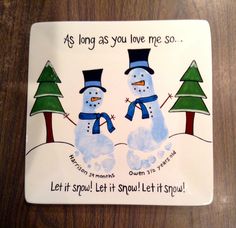 a ceramic plate with two snowmen and trees on it, says as long as you love me so let it snow