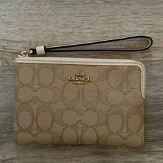 Never Used! Brand New Coach Wristlet! 6 Inches Long, 4 1/4 Inches Tall White Clutch Wristlet With Zipper Closure, Elegant Beige Coach Wristlet, White Clutch Wristlet With Wrist Strap, White Wristlet Clutch With Wrist Strap, Elegant Cream Clutch With Zipper Closure, Elegant Beige Clutch Wristlet, Elegant Beige Clutch With Wrist Strap, Elegant Beige Rectangular Wristlet, Coach Beige Pouch Wristlet