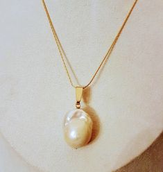 Baroque pearl pendant 20mm x 15mm (approx.) with brass gold-plated bail and pin. Chain not included in price. Pearls vary slightly in shape and size. Gold Pearl Necklace With Large Pendant, Handmade Gold Baroque Pearl Necklace, Handmade Baroque Gold Pearl Necklace, Unique Gold Pearl Drop Necklace, Unique Gold Necklace With Pearl Drop, Unique Gold Pendant Pearl Necklace, Gold Baroque Pearl Teardrop Pendant, Gold Baroque Pearl Teardrop Pendant Jewelry, Gold Teardrop Pendant Jewelry With High Luster