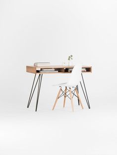 a white chair sitting next to a wooden table