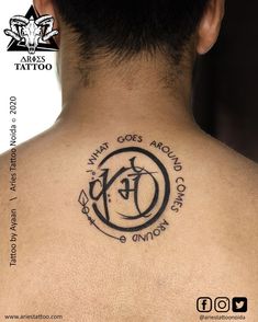 the back of a man's neck with a tattoo on it that says what goes around