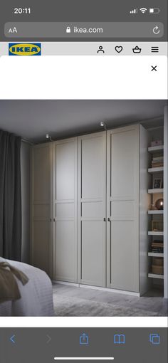 an image of a bedroom with white cupboards