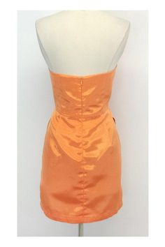 Size 8 Strapless Pleat Dress in Orange Sherbet Retails for $305.00 Body 100% Polyester Lining 100% Acetate Made in the USA Concealed back zip and clasp Pleat detail on bust and below waist On seam hip pockets Bone in bodice Across top of bust 16.5" Under bust 15.25" Bust to hem 19.25" Hips 38.5" Total length 28" Summer Party Dress With Invisible Zipper, Orange Satin Evening Dress, Fitted Silk Strapless Dress With Sweetheart Neckline, Silk Fitted Strapless Dress With Straight Neckline, Summer Dress With Fitted Bodice And Invisible Zipper, Fitted Strapless Silk Mini Dress, Summer Silk Strapless Dress For Formal Occasions, Summer Silk Strapless Formal Dress, Fitted Silk Strapless Dress For Cocktail