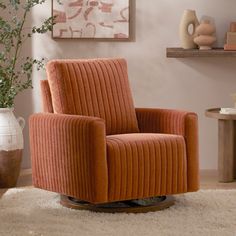 an orange chair sitting on top of a white rug