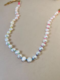 ✨7-8 mm Chunky Freshwater pearls ✨Colorful Neon Thread  ✨Gold Plated Clasp ✨Necklace Length: 15" + 2" extension 🧿 If you require a custom size send a message with your order 💫 Allow 1- 3 business days for the production before shipping. 💫 All jewelry comes in a cute pouch for storage. 💫 This product is handcrafted and shipped from Palm Beach, FL. ✨To view my entire collection please visit my ETSY SHOP✨ https://lunnajewelryfl.etsy.com Necklace Thread, Hand Knotted Jewelry, Handmade Pearl Necklace, Chunky Pearl Necklace, Cute Pouch, Rainbow Pearl, Chunky Pearls, Thread Necklace, Flower Choker