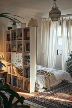 a bedroom with a bed, bookshelf and plants