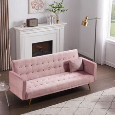 a living room filled with furniture and a fire place in front of a white fireplace