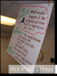 a bulletin board hanging from the ceiling with writing on it that says what would happen if the