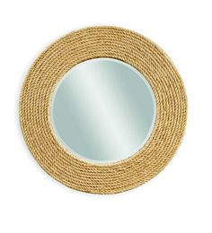 a round mirror with rope around it