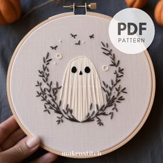 a hand embroidery pattern with a ghost on it