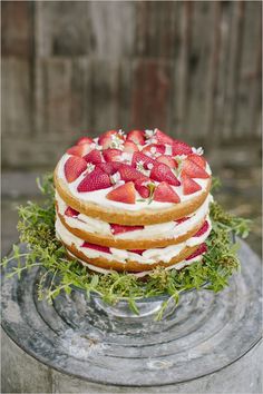 a cake with strawberries and icing on top