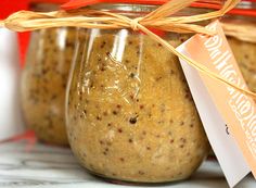 two jars filled with oatmeal sitting on top of a table