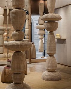 a room filled with lots of stacked wooden objects in it's centerpieces