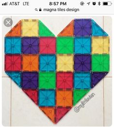 a colorful heart made out of plastic blocks