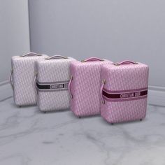 three pieces of luggage sitting next to each other on a marble counter top in front of a mirror