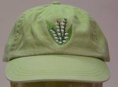 Lily of Valley May Flower of Month Hat - Embroidered Women Garden Cap - 24 Colors Available - Price Apparel Embroidery Spring Embroidered Green Baseball Cap, Green Embroidered Baseball Cap For Spring, Flower Of Month, Embroidered Lily, Lily Of Valley, May Flower, Gardening Hat, How To Wash Hats, Garden Gift