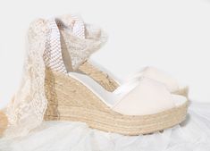 We SHIP ✈️ 🌍 WORLDWIDE! ANNA Peep Toe Wedge Espadrilles Organic cotton upper in ivory color. Ribbon ties in ivory color made of soft and high quality Chantilly Lace. If you want the lace ribbon in any other color or material as satin, organza or tulle, please contact us. Wedge heel made of natural jute. HEEL HEIGHT: -Platform Heel: 4 inches ( 10 cm) -High Heel: 3.34 inches ( 8.5 cm ) -Medium Heel: 1.96 Inches ( 5 cm ) *SIZES: Order your true size. If you normally fall in between sizes, we recom Reception Shoes, Wedding Shoes Platform, Lace Espadrilles, Ivory Bridal Shoes, Wedge Wedding Shoes, Beach Wedding Shoes, Wedding Shoes Comfortable, Beige Wedding, Boho Style Wedding