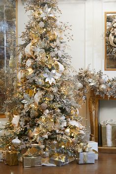 a christmas tree with gold and silver decorations