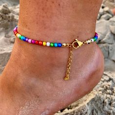 Look at this MAGICAL anklet! Isn't it just beautiful?😍 In my opinion this anklet has it all: bright and beautiful colors, a bit bling (the chain) and a little heart. The beads can play in water all day long, but the color of the chain will tarnish in water, so I reccomend taking the anklet of when showering/bathing.  Luckily we are not cast in the same mold so the anklets are in 4 different lenghts and you adjust the lenght with the steel chain.  The lenghts are: 18-21 cm 22-25 cm 26-29 cm 30-33 cm To find the right size, messure tight around your ankle and over your ankle bone and add 1 cm.  Let me know if you need a smaller/larger anklet, I fix👍🏼 Rainbow Anklet, Bright And Beautiful, Ankle Bones, Take A Shower, Anklet Jewelry, Body Jewellery, 2 Months, Ankle Bracelets, Steel Chain