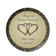 an anniversary plate with two hearts on it