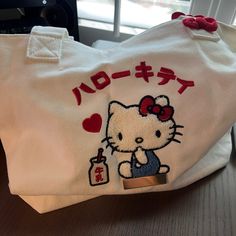 Nwot Sanrio Hello Kitty Embroidered Canvas Tote Bag With Charm Measurements Tote: 10-1/4"W X 10-1/2"H X 4"D Charm:2-1/2"W X 3-3/4"H X 1"D Color May Vary Due To Lighting Described To The Best Of My Knowledge Happy Shopping Kawaii White Canvas Bag For Everyday Use, Cute Embroidered Rectangular Shoulder Bag, White Kawaii Canvas Bag For Everyday, White Kawaii Canvas Bag, Cute White Tote Shoulder Bag, Everyday White Kawaii Canvas Bag, White Shoulder Bag With Cat Design As Gift, White Shoulder Bag With Cat Design For Gift, White Cat Design Shoulder Bag For Gift