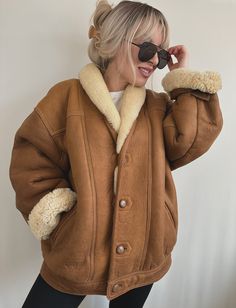 "Rare find. Quality item. Genuine shearling. Super heavy and warm. Regular, relaxed fit.  Features:   V neck collar Two side pockets  Buttons on the right hand side  Button closure  Fully lined with wool Measures:  26\" pit to pit  30\" long  For reference I'm size small. Please check measurements before buying.  Vintage piece in excellent overall condition. no major flaws or bad smell. Looks great on both men and women Message me for any questions.  All sales are final. Please read my store policy before making a purchase. Thank you!" Rugged Winter Outerwear With Button Closure, Fall Sheepskin Fur Coat With Fleece Lining, Fall Outerwear With Fleece Lining And Sheepskin, Fall Sheepskin Outerwear With Fleece Lining, Winter Sheepskin Leather Jacket With Pockets, Sheepskin Aviator Outerwear For Fall, Classic Fur Coat With Pockets For Fall, Classic Aviator Outerwear For Fall, Classic Aviator-style Outerwear For Fall